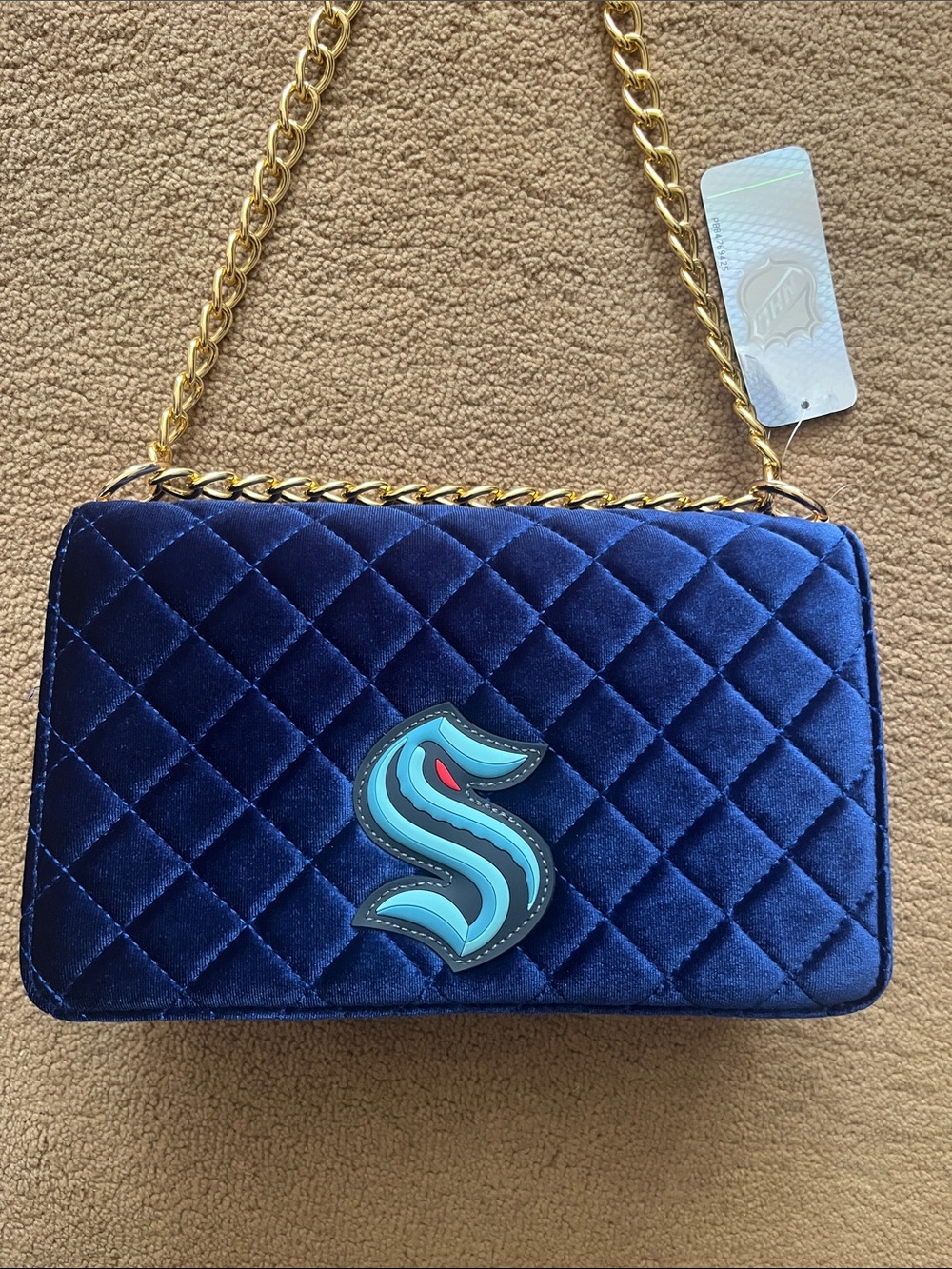 NHL Quilted Navy Velvet Shoulder Bag with Gold Chain and Teal Emblem